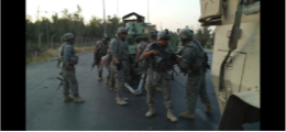Soldiers gathered in a field scene from Iraq Pic Short